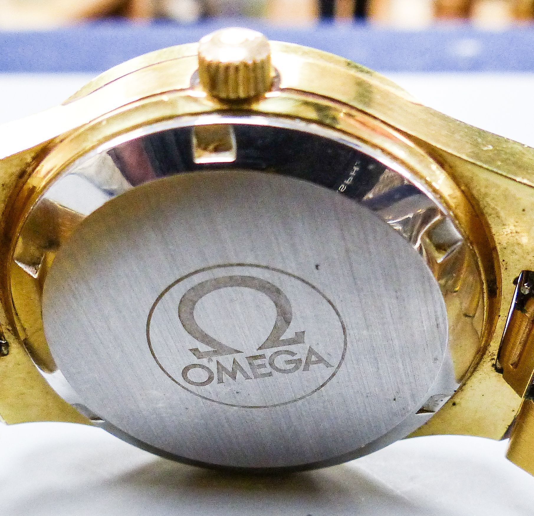 A gentleman's gold plated Omega automatic wristwatch, with date aperture, on a gold plated Omega bracelet, case diameter 37mm.